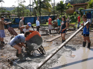 Students from ILSU biding a basketball court at a local school in Costa Rica